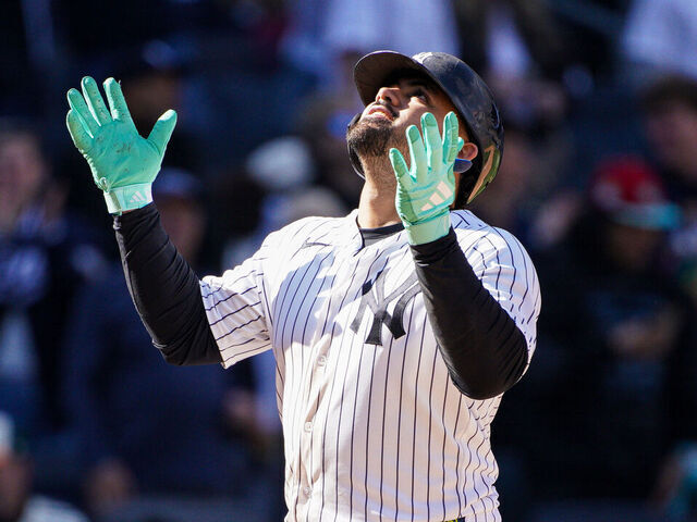 NEW YORK, NEW YORK - MAY 03: Jasson Domínguez #24 of the New York Yankees gestures after crossing home plate off of his eighth inning two-run home run against the Baltimore Orioles at Yankee Stadium on May 03, 2026 in New York City.