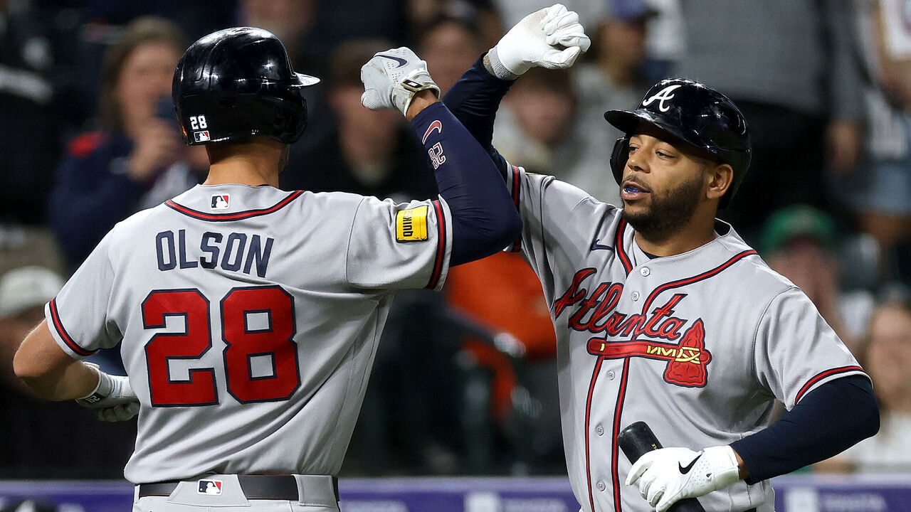 DENVER, COLORADO - MAY 02: Matt Olson #28 of the Atlanta Braves celebrates with Dominic Smith #8 after hitting a solo home run against the Colorado Rockies in the ninth inning at Coors Field on May 02, 2026 in Denver, Colorado.