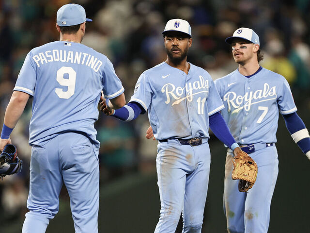 SEATTLE, WASHINGTON - MAY 02: Maikel Garcia #11 of the Kansas City Royals high fives Vinnie Pasquantino #9 of the Kansas City Royals after beating the Seattle Mariners in the tenth inning 3-2 at T-Mobile Park on May 02, 2026 in Seattle, Washington.