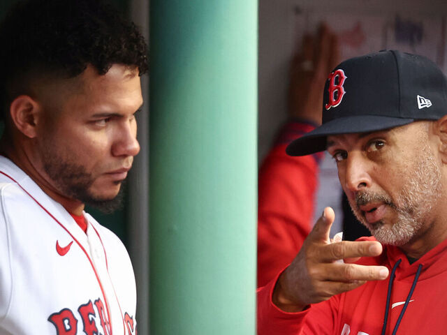 BOSTON, MA - APRIL 5: Manager Alex Cora #13 of the Boston Red Sox talks with Willson Contreras #40 during the game against the San Diego Padres at Fenway Park on April 5, 2026 in Boston, Massachusetts.