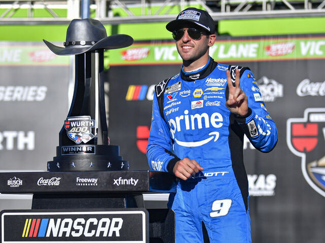 FORT WORTH, TX - MAY 03: Chase Elliott (#9 Hendrick Motorsports Amazon Prime Chevrolet) poses next to the trophy after winning NASCAR Cup Series Wurth 400 on May 3, 2026, at the Texas Motor Speedway in Fort Worth, TX.