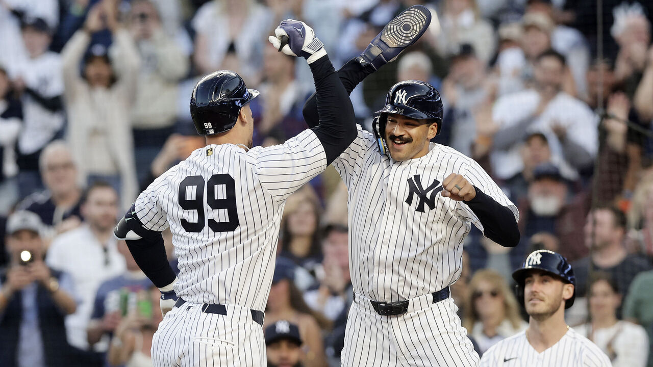 NEW YORK, NEW YORK - MAY 04: Aaron Judge #99 of the New York Yankees is congratulated by Trent Grisham #12 after his first inning two-run home run against the Baltimore Orioles at Yankee Stadium on May 04, 2026, in the Bronx borough of New York City.