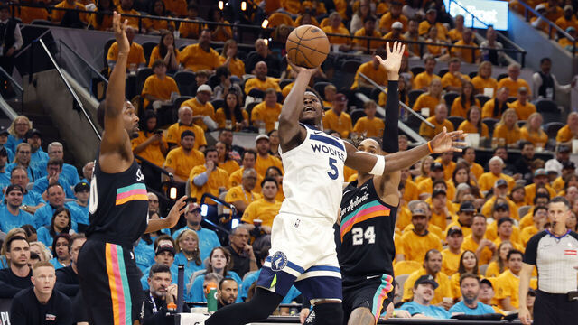 SAN ANTONIO, TEXAS - MAY 04: Anthony Edwards #5 of the Minnesota Timberwolves shoots the ball in front of Devin Vassell #24 and Harrison Barnes #40 of the San Antonio Spurs during the second quarter in Game One of the Second Round of the NBA Western Conference Playoffs at Frost Bank Center on May 04, 2026 in San Antonio, Texas.