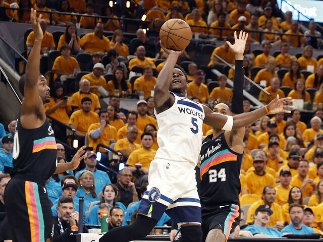 SAN ANTONIO, TEXAS - MAY 04: Anthony Edwards #5 of the Minnesota Timberwolves shoots the ball in front of Devin Vassell #24 and Harrison Barnes #40 of the San Antonio Spurs during the second quarter in Game One of the Second Round of the NBA Western Conference Playoffs at Frost Bank Center on May 04, 2026 in San Antonio, Texas.