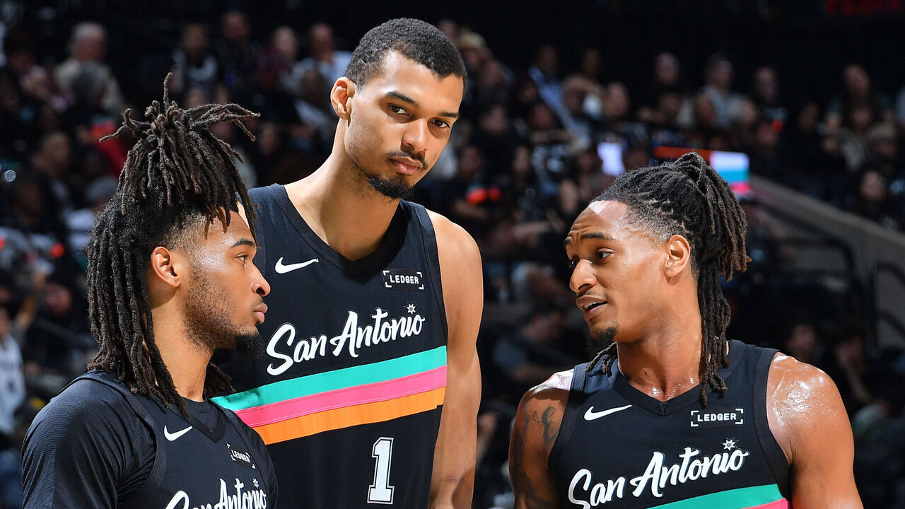 SAN ANTONIO, TX - MARCH 6: Stephon Castle #5, Victor Wembanyama #1, and Devin Vassell #24 of the San Antonio Spurs talk during the game against the LA Clippers on March 6, 2026 at the Frost Bank Center in San Antonio, Texas. Mandatory Copyright Notice: Copyright 2026 NBAE (Photos by Michael Gonzales/NBAE via Getty Images)
