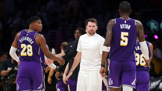 LOS ANGELES, CALIFORNIA - APRIL 29: Luka Doncic #77 of the Los Angeles Lakers greets Deandre Ayton #5 during a timeout during the second quarter against the Houston Rockets in Game Five of the First Round of the NBA Western Conference Playoffs at Crypto.com Arena on April 29, 2026 in Los Angeles, California.
