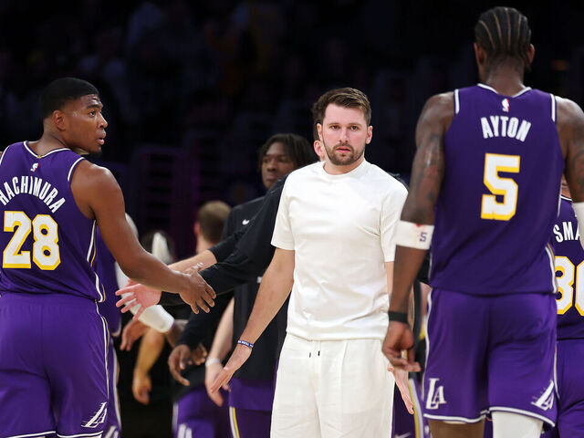LOS ANGELES, CALIFORNIA - APRIL 29: Luka Doncic #77 of the Los Angeles Lakers greets Deandre Ayton #5 during a timeout during the second quarter against the Houston Rockets in Game Five of the First Round of the NBA Western Conference Playoffs at Crypto.com Arena on April 29, 2026 in Los Angeles, California.