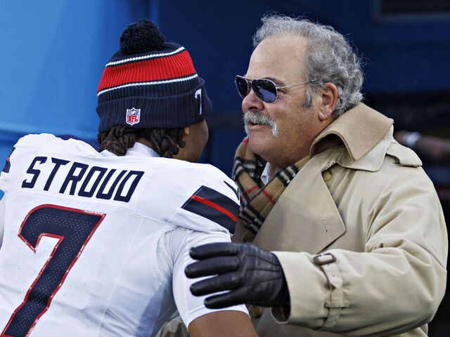 NASHVILLE, TENNESSEE - JANUARY 5: C.J. Stroud #7 hugs Owner Cal McNair of the Houston Texans after a game against the Tennessee Titans at Nissan Stadium on January 5, 2025 in Nashville, Tennessee. The Texans defeated the Titans 23-14.