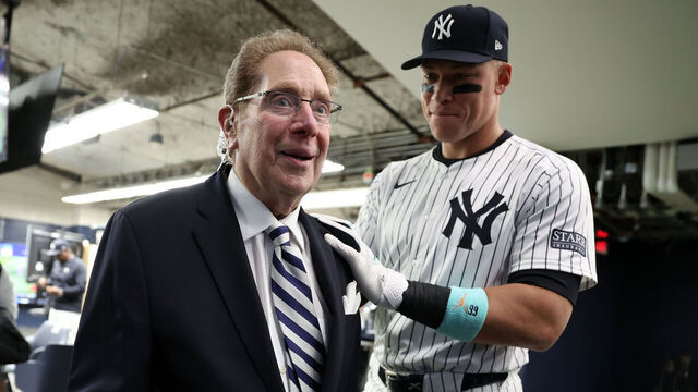 NEW YORK, NY - APRIL 20: New York Yankees radio broadcasters John Sterling speaks with Aaron Judge #99 of the New York Yankees prior to the game against the Tampa Bay Rays at Yankee Stadium on April 20, 2024, in New York, New York.