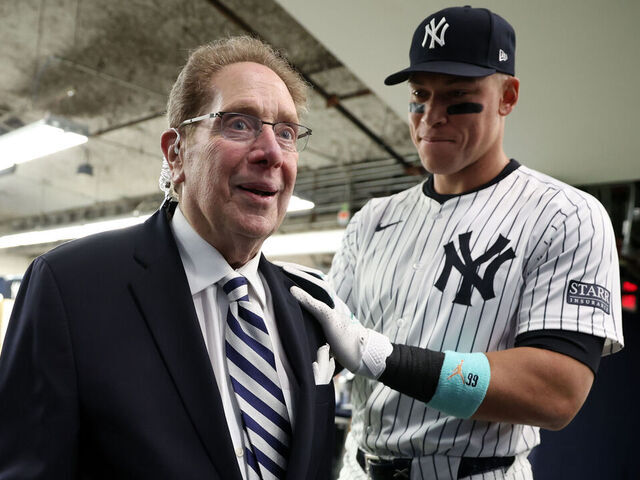NEW YORK, NY - APRIL 20: New York Yankees radio broadcasters John Sterling speaks with Aaron Judge #99 of the New York Yankees prior to the game against the Tampa Bay Rays at Yankee Stadium on April 20, 2024, in New York, New York.