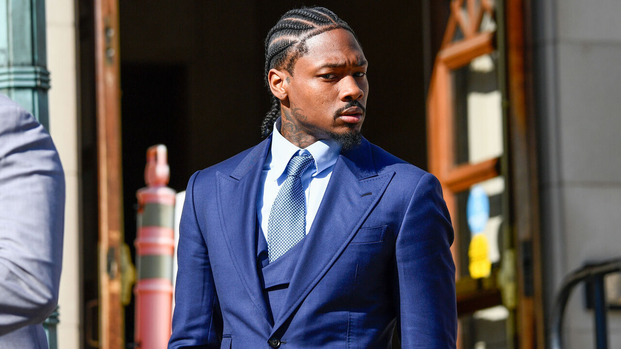DEDHAM, MA - MAY 04: Professional football wide receiver Stefon Diggs walks out of Dedham District Court on May 4, 2026, following the first day of his assault trial. Diggs has pleaded not guilty to charges of felony strangulation and misdemeanor assault and battery.