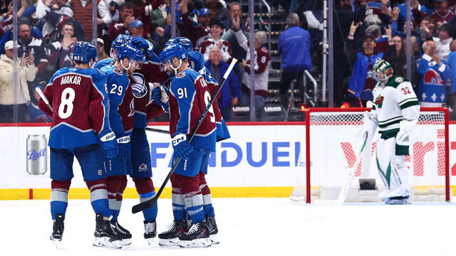 DENVER, COLORADO - MAY 05: Nathan MacKinnon #29 of the Colorado Avalanche congratulated by teammates after scoring a goal against the Minnesota Wild during the third period in Game Two of the Second Round of the 2026 Stanley Cup Playoffs at Ball Arena on May 05, 2026 in Denver, Colorado.