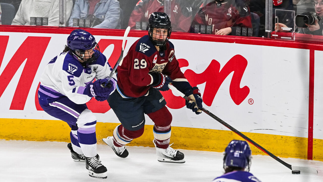 LAVAL, QC - MAY 02: Montreal Victoire forward Marie-Philip Poulin (29) plays the puck against Minnesota Frost defensewoman Sidney Morin (5) during game one of the Walter Cup Playoffs between the Minnesota Frost and the Montreal Victoire on May 02, 2026, at Place Bell in Laval, QC