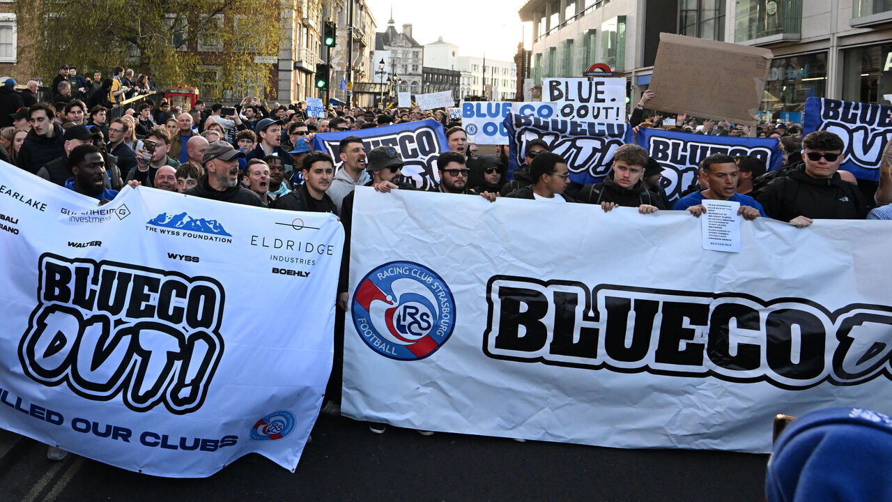 Chelsea fans joined by the fans of French club Strasbourg hold a protest against BlueCo group, led by American businessman Todd Boehly outside the ground before the English Premier League football match between Chelsea and Manchester United at Stamford Bridge in London on April 18, 2026.