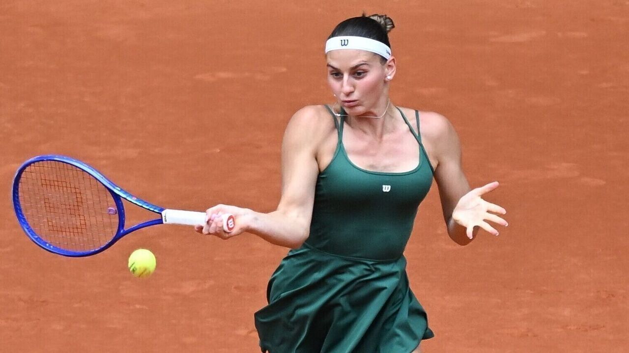 Marta Kostyuk of Ukraine hits a return during the women's singles final between Marta Kostyuk of Ukraine and Mirra Andreeva of Russia at the 2026 Madrid Open tennis tournament in Madrid, Spain, May 2, 2026.
