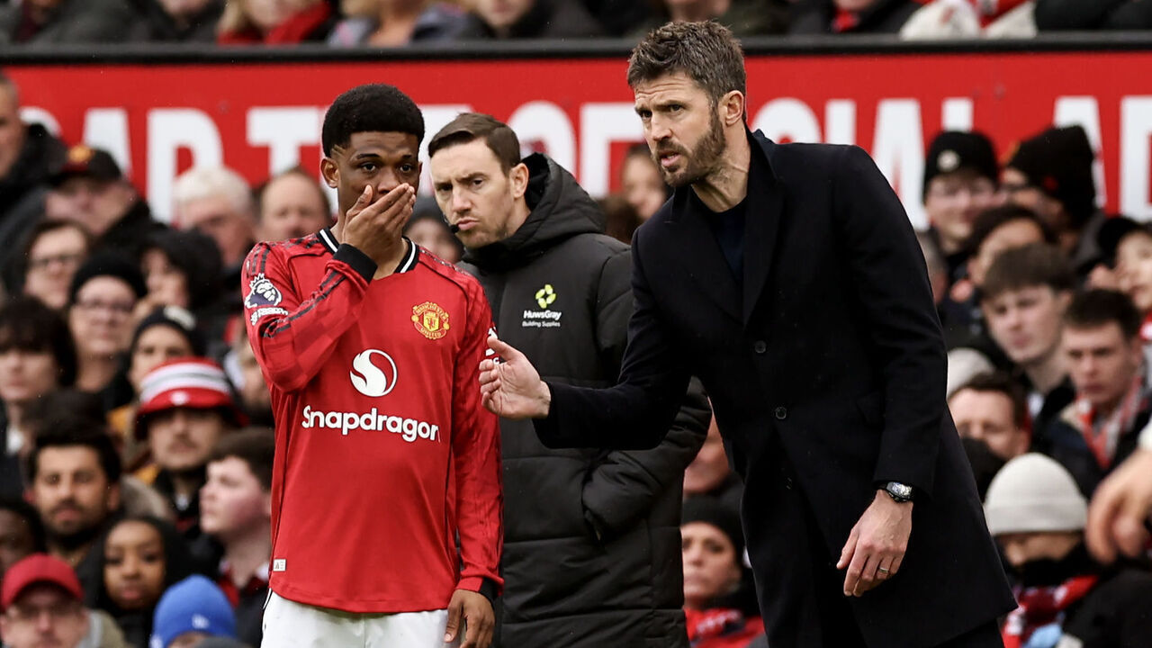 MANCHESTER, ENGLAND - MARCH 15: Manchester United manager Michael Carrick talks to Amad Diallo during a break in play in the Premier League match between Manchester United and Aston Villa at Old Trafford on March 15, 2026 in Manchester, United Kingdom.