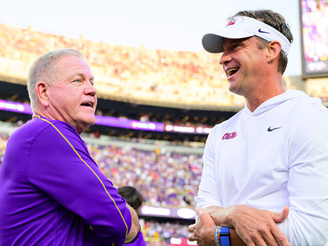 BATON ROUGE, LOUISIANA - OCTOBER 12: Head Coach Brian Kelly of the LSU Tigers talks with Head Coach Lane Kiffin of the Ole Miss Rebels before the game against the Ole Miss Rebels at Tiger Stadium on October 12, 2024 in Baton Rouge, Louisiana. (Photo by Gus Stark/LSU/University Images via Getty Images}