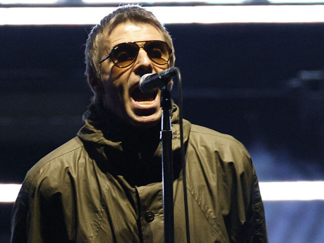 Lead singer of British rock band Oasis Liam Gallagher performs on stage at Soldier Field in Chicago on August 28, 2025, during the band's reunion tour. British rock legends Oasis kicked off the North American leg of their blockbuster reunion tour in Toronto on August 24 as ecstatic Canadian fans flocked to their first chance to see the band since 2008.