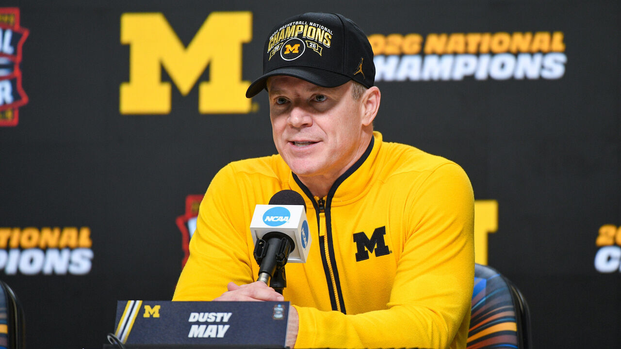 INDIANAPOLIS, INDIANA - APRIL 06: Head Basketball Coach Dusty May of the Michigan Wolverines speaks to media during the post game press conference after winning the 2026 NCAA Men's Basketball Tournament national championship game against the UConn Huskies at Lucas Oil Stadium on April 06, 2026 in Indianapolis, Indiana. The Michigan Wolverines won the game 69-63.
