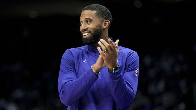 DETROIT, MICHIGAN - FEBRUARY 09: Head Coach Charles Lee of the Charlotte Hornets claps and smiles against the Detroit Pistons at Little Caesars Arena on February 09, 2025 in Detroit, Michigan.