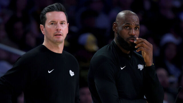 LOS ANGELES, CALIFORNIA - APRIL 12: LeBron James #23 of the Los Angeles Lakers and head coach JJ Redick watch from the sidelines during the first half against the Utah Jazz at Crypto.com Arena on April 12, 2026 in Los Angeles, California.