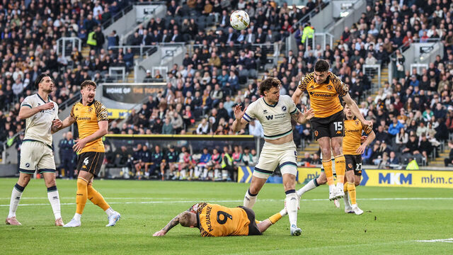 John Egan of Hull City heads the ball clear during the Sky Bet Championship Play-Offs Semi-Final first leg between Hull City and Millwall at MKM Stadium in Hull, United Kingdom, on May 8, 2026.