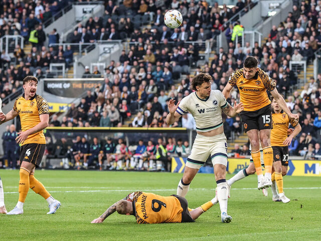 John Egan of Hull City heads the ball clear during the Sky Bet Championship Play-Offs Semi-Final first leg between Hull City and Millwall at MKM Stadium in Hull, United Kingdom, on May 8, 2026.