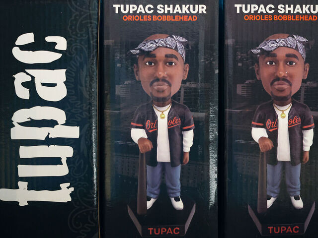 BALTIMORE, MARYLAND - MAY 08: A Tupac Shakur Baltimore Orioles bobblehead is seen on display as the promotional giveaway before the Orioles play against the Athletics at Oriole Park at Camden Yards on May 08, 2026 in Baltimore, Maryland.