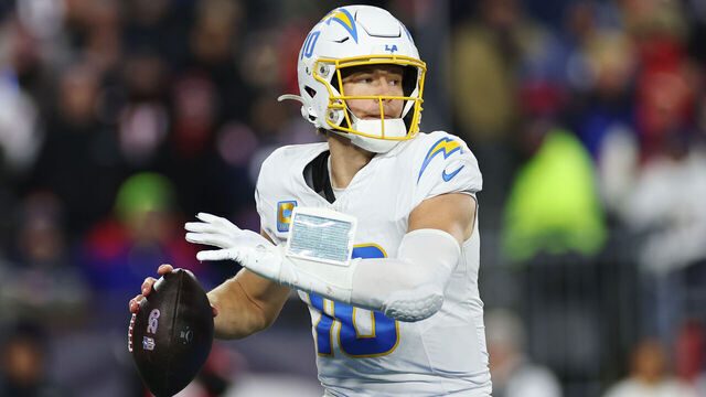 FOXBOROUGH, MASSACHUSETTS - JANUARY 11: Justin Herbert #10 of the Los Angeles Chargers in action during the AFC Wild Card Playoff game against the New England Patriots at Gillette Stadium on January 11, 2026 in Foxborough, Massachusetts.