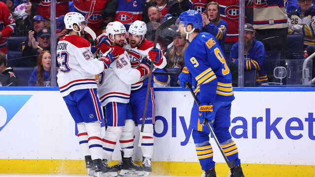 BUFFALO, NEW YORK - MAY 08: Alex Newhook #15 of the Montreal Canadiens celebrates his second period goal against the Buffalo Sabres with Alexandre Carrier #45 and Noah Dobson in Game Two of the Second Round of the 2026 Stanley Cup Playoffs at KeyBank Center on May 08, 2026 in Buffalo, New York.