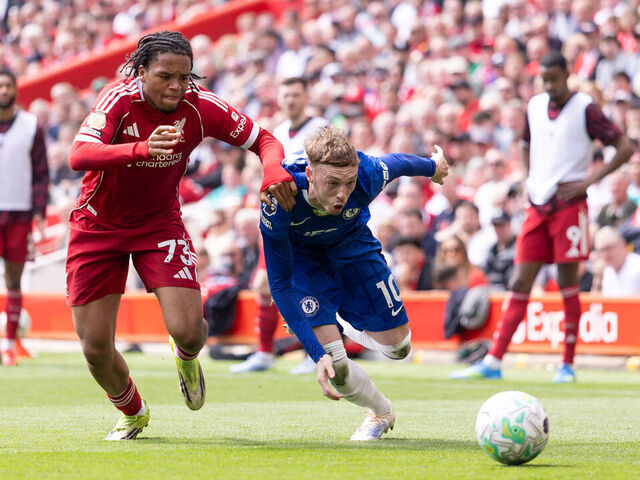 LIVERPOOL, ENGLAND - MAY 9: Cole Palmer of Chelsea is challenged by Rio Ngumoha of Liverpool during the Premier League match between Liverpool and Chelsea at Anfield on May 9, 2026 in Liverpool, England.