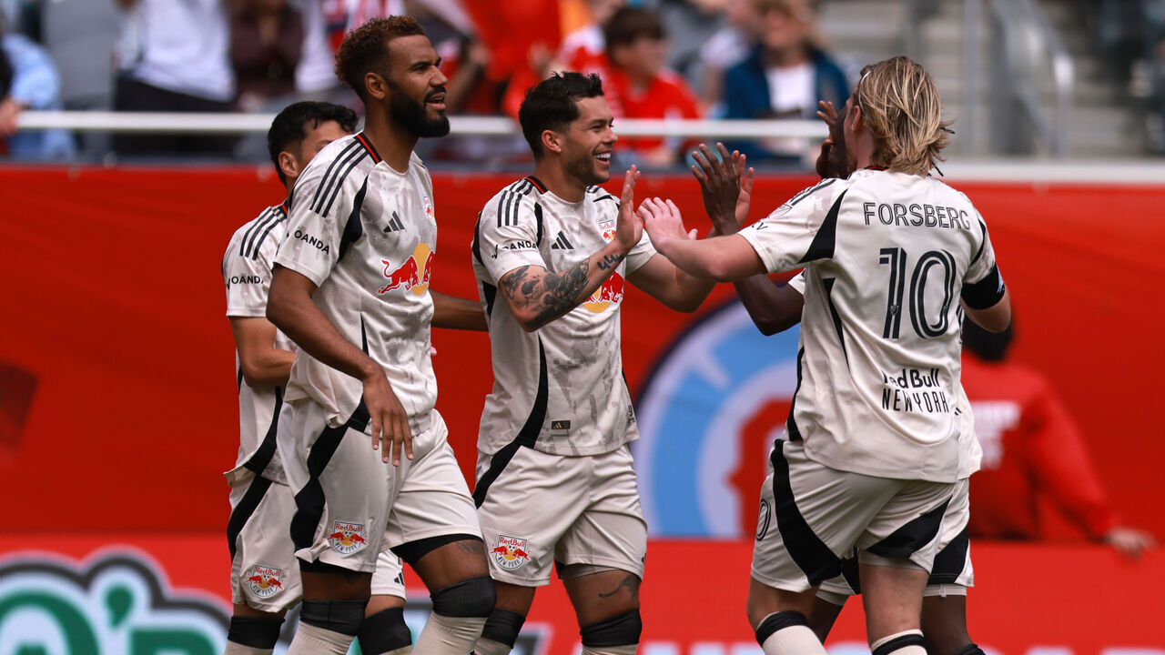 CHICAGO, ILLINOIS - MAY 9: Cade Cowell #7 of Red Bull New York celebrates scoring a goal with teammate Emil Forsberg #10 during the second half against Chicago Fire FC at Soldier Field on May 9, 2026 in Chicago, Illinois.