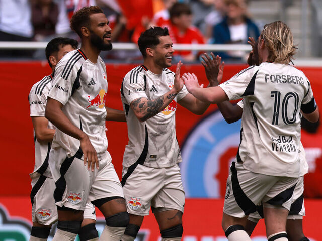 CHICAGO, ILLINOIS - MAY 9: Cade Cowell #7 of Red Bull New York celebrates scoring a goal with teammate Emil Forsberg #10 during the second half against Chicago Fire FC at Soldier Field on May 9, 2026 in Chicago, Illinois.