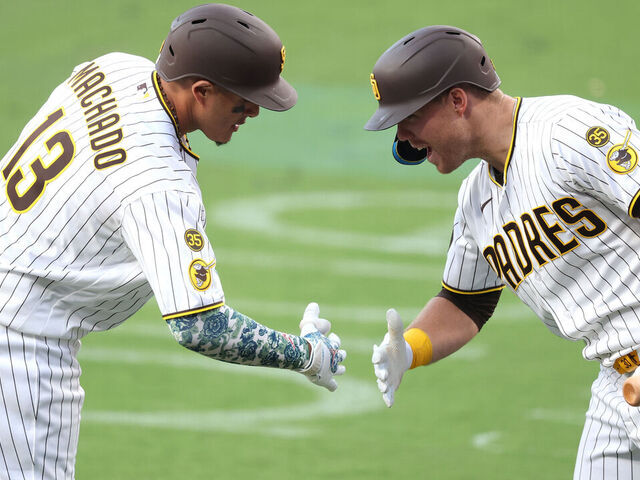 SAN DIEGO, CALIFORNIA - MAY 09: Gavin Sheets #30 congratulates Manny Machado #13 of the San Diego Padres reacts after his solo homerun during the eighth inning of a game against the St. Louis Cardinals at Petco Park on May 09, 2026 in San Diego, California.