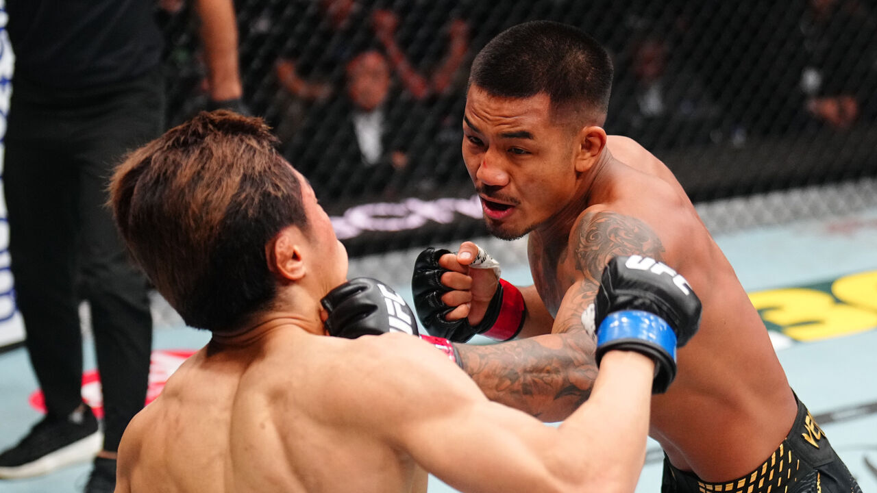NEWARK, NEW JERSEY - MAY 09: (R-L) Joshua Van of Myanmar punches Tatsuro Taira of Japan in the UFC flyweight championship fight during the UFC 328 event at Prudential Center on May 09, 2026 in Newark, New Jersey.