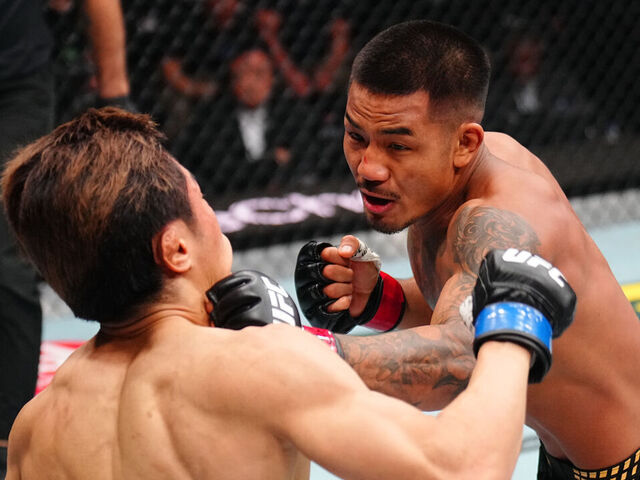 NEWARK, NEW JERSEY - MAY 09: (R-L) Joshua Van of Myanmar punches Tatsuro Taira of Japan in the UFC flyweight championship fight during the UFC 328 event at Prudential Center on May 09, 2026 in Newark, New Jersey.