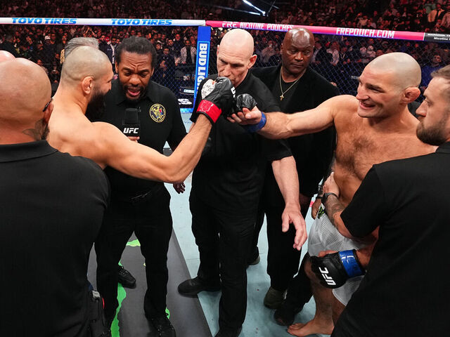 NEWARK, NEW JERSEY - MAY 09: (L-R) Khamzat Chimaev of Russia and Sean Strickland touch gloves prior to the UFC middleweight championship fight during the UFC 328 event at Prudential Center on May 09, 2026 in Newark, New Jersey.