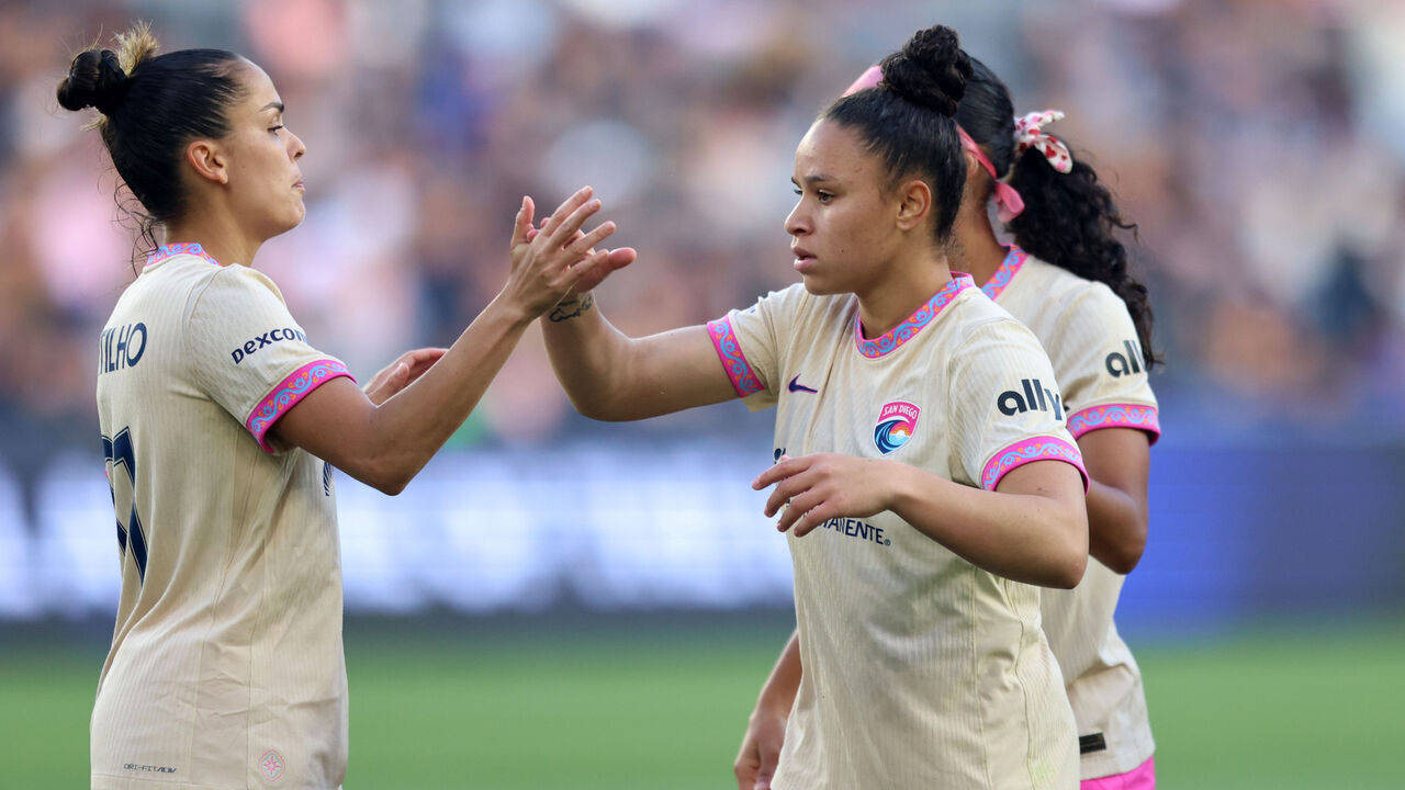 LOS ANGELES, CALIFORNIA - MAY 09: Dudinha #88 of San Diego Wave FC celebrates scoring her team's first goal with teammates Gabi Portilho #81 and Amelia Van Zanten #16 during the NWSL match between Angel City FC and San Diego Wave FC at BMO Stadium on May 09, 2026 in Los Angeles, California.