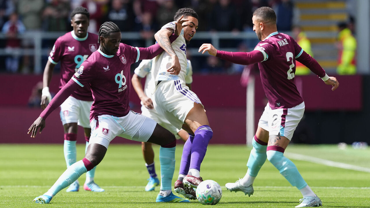 Burnley's Axel Tuanzebe (left) and Burnley's Kyle Walker (right) battle for the ball with Aston Villa's Morgan Rogers (centre) and during the Premier League match at Turf Moor, Burnley. Picture date: Sunday May 10, 2026.
