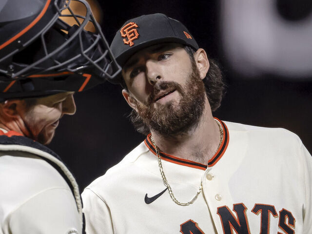 Ryan Walker (74) makes Patrick Bailey (14) smile after the San Francisco Giants defeated the Los Angeles Dodgers 3-0 at Oracle Park in San Francisco, on Wednesday, April 22, 2026.