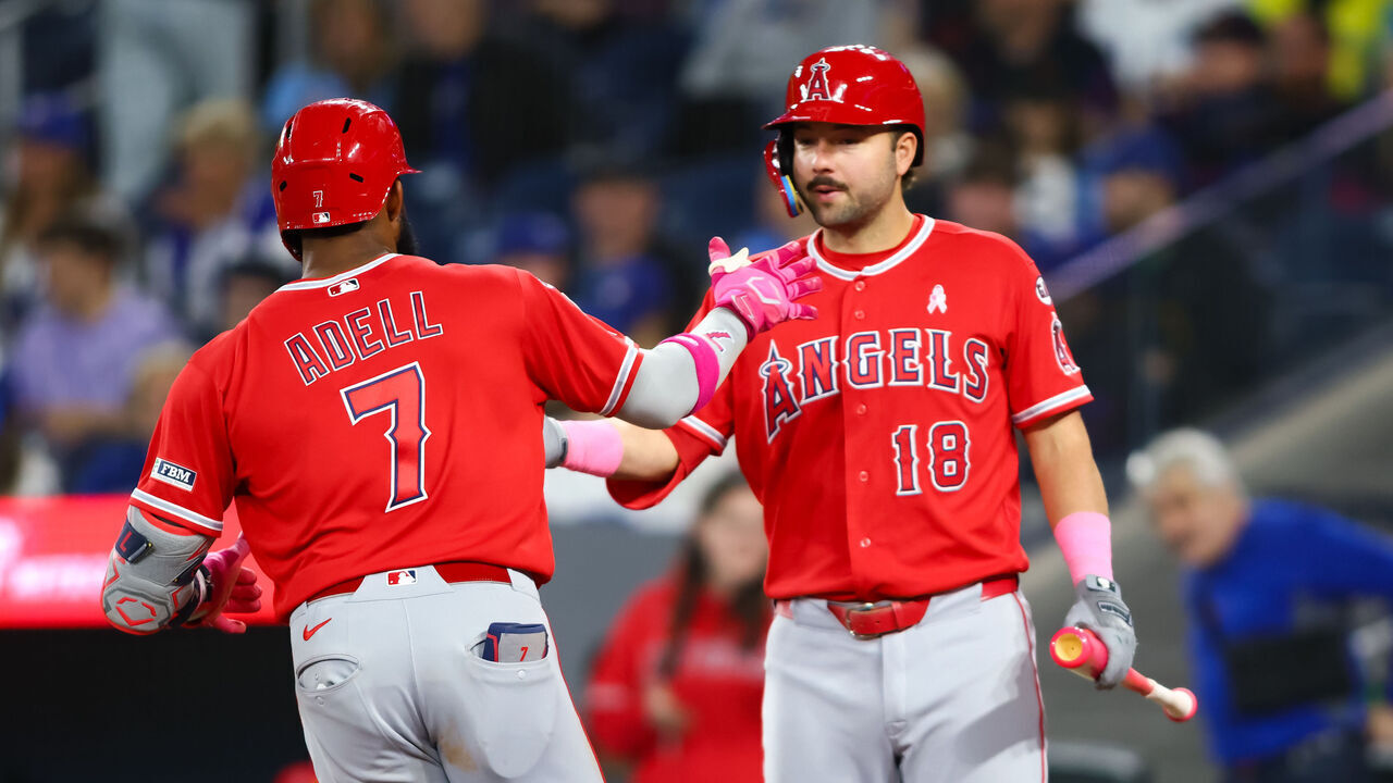TORONTO, CANADA - MAY 10: Jo Adell #7 and Nolan Schanuel #18 of the Los Angeles Angels celebrate Adell's solo-home run in the ninth inning of their MLB game against the Toronto Blue Jays at Rogers Centre on May 10, 2026 in Toronto, Ontario, Canada.