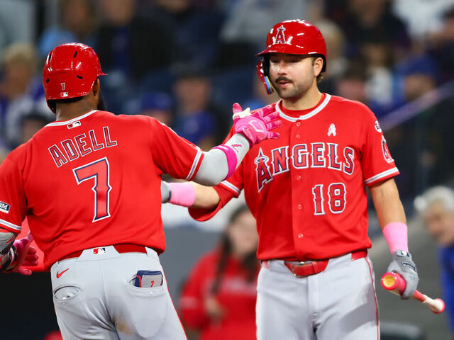 TORONTO, CANADA - MAY 10: Jo Adell #7 and Nolan Schanuel #18 of the Los Angeles Angels celebrate Adell's solo-home run in the ninth inning of their MLB game against the Toronto Blue Jays at Rogers Centre on May 10, 2026 in Toronto, Ontario, Canada.