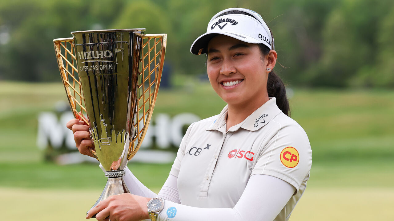 WEST CALDWELL, NJ - MAY 10: Atthaya Thitikul of Thailand celebrates with the Mizuho Americas Open trophy after winning the Mizuho Americas Open on May 10, 2026 at Mountain Ridge Country Club in West Caldwell, New Jersey.
