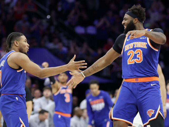 PHILADELPHIA, PENNSYLVANIA - MAY 10: Miles McBride #2 and Mitchell Robinson #23 of the New York Knicks celebrate after a basket against the Philadelphia 76ers during the second quarter in Game Four of the Second Round of the NBA Eastern Conference Playoffs at Xfinity Mobile Arena on May 10, 2026 in Philadelphia, Pennsylvania.