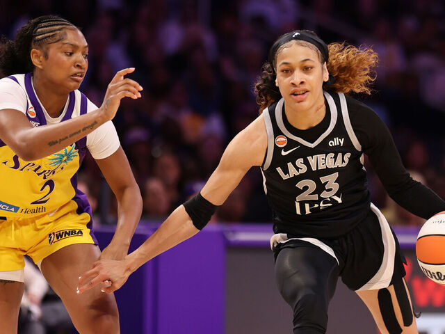 LOS ANGELES, CALIFORNIA - MAY 10: Chennedy Carter #23 of the Las Vegas Aces plays the ball against Chance Gray #2 of the Los Angeles Sparks during the first half of their game at Crypto.com Arena on May 10, 2026 in Los Angeles, California.