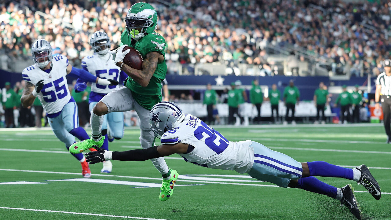 ARLINGTON, TEXAS - NOVEMBER 23: DeVonta Smith #6 of the Philadelphia Eagles is brought down by DaRon Bland #26 of the Dallas Cowboys during a game at AT&T Stadium on November 23, 2025 in Arlington, Texas.