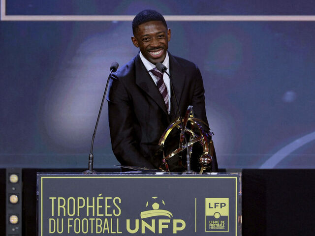Paris Saint-Germain's French forward #10 Ousmane Dembele receives the Ligue 1 best player award during the 34th UNFP's (France's professional players union) French football awards ceremony in Paris on May 11, 2026.
