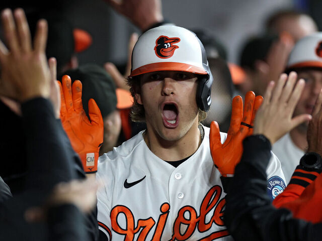 BALTIMORE, MARYLAND - MAY 11: Coby Mayo #16 of the Baltimore Orioles celebrates in the dugout with teammates after hitting a three run home run against the New York Yankees during the seventh inning at Oriole Park at Camden Yards on May 11, 2026 in Baltimore, Maryland.