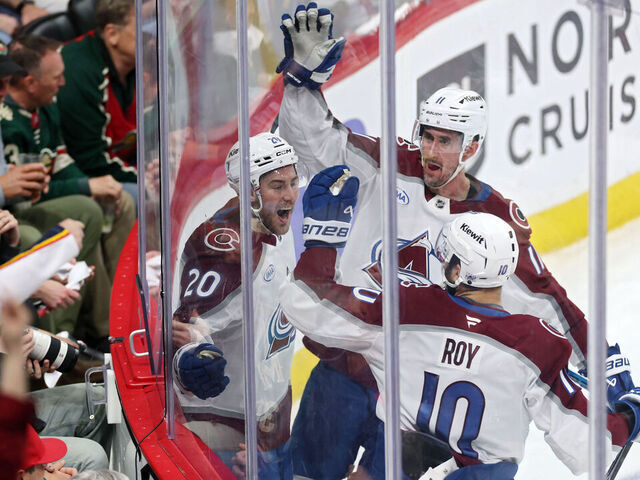 ST PAUL, MINNESOTA - MAY 11: Ross Colton #20 of the Colorado Avalanche celebrates with Brock Nelson #11 and Nicolas Roy #10 after scoring a goal against Jesper Wallstedt #30 of the Minnesota Wild during the third period in Game Four of the Second Round of the 2026 Stanley Cup Playoffs at Grand Casino Arena on May 11, 2026 in St Paul, Minnesota.