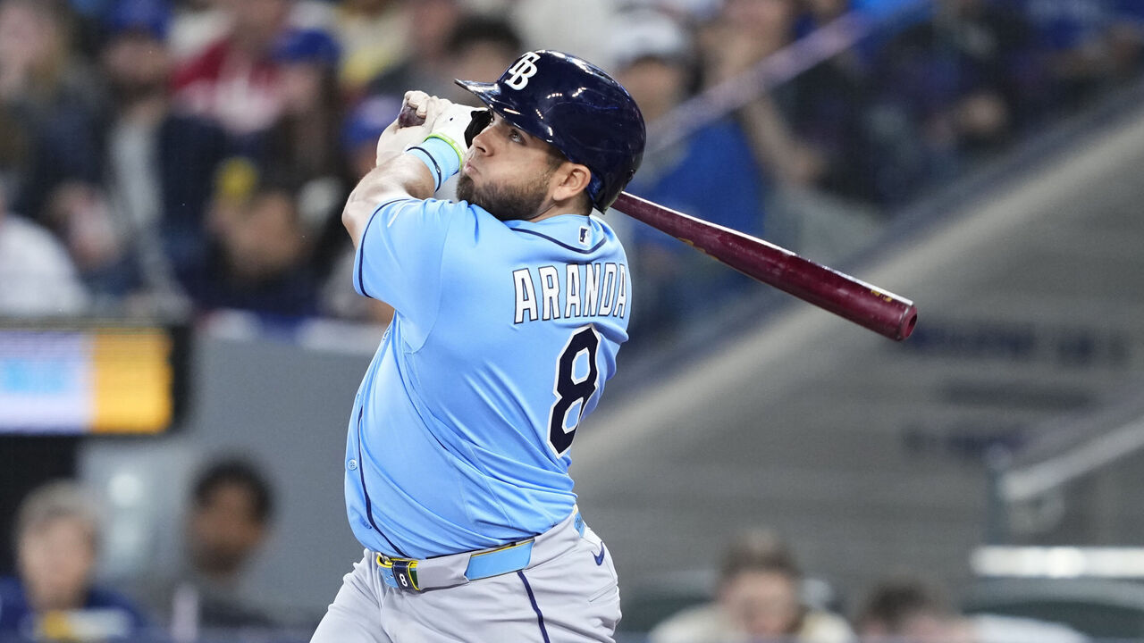 TORONTO, CANADA - MAY 11: Jonathan Aranda #8 of the Tampa Bay Rays hits an RBI sacrifice fly against the Toronto Blue Jays during the first inning in their MLB game at the Rogers Centre on May 11, 2026 in Toronto, Ontario, Canada.